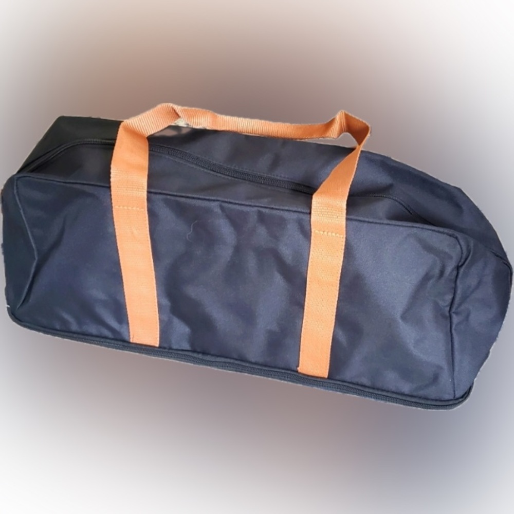 NIP DSW
Black canvas backpack and duffle bag with Tan accent